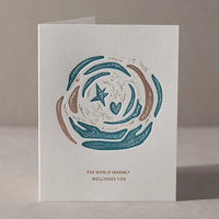 The World Warmly Welcomes You Greeting Card